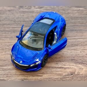 die-cast model car of a 2017 Acura NSX, also known as the Honda NSX.